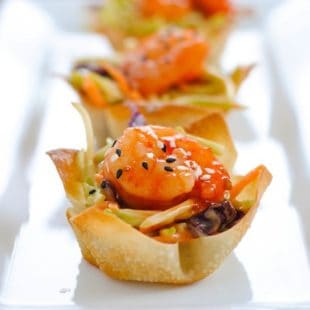 Asian Shrimp Wonton Cups - Crunchy wonton cups filled with broccoli slaw and topped with sweet chili glazed shrimp. Special yet incredibly simple! | foxeslovelemons.com