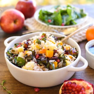 Autumn Celebration Rice Salad - A gluten-free and vegetarian holiday side dish option, loaded with butternut squash, pomegranate, swiss chard, dried cranberries, apples and pistachios, tossed with homemade apple cider vinaigrette! | foxeslovelemons.com