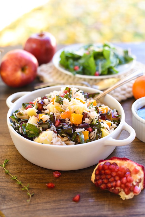 Autumn Celebration Rice Salad - A gluten-free and vegetarian holiday side dish option, loaded with butternut squash, pomegranate, swiss chard, dried cranberries, apples and pistachios, tossed with homemade apple cider vinaigrette! | foxeslovelemons.com