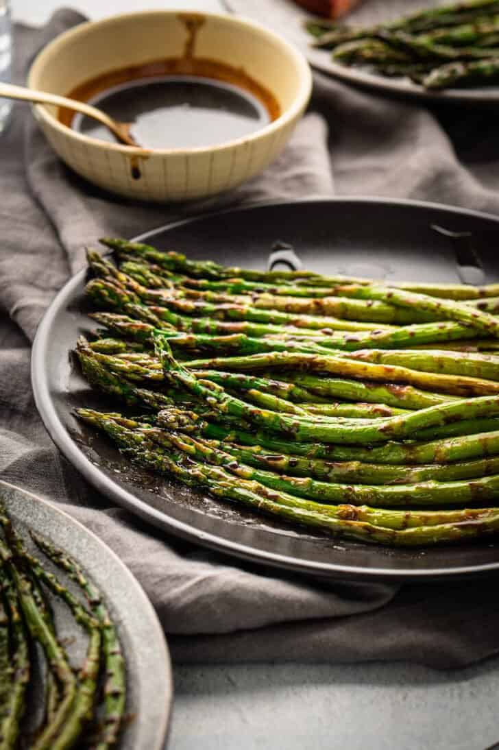 An oven roasted asparagus recipe with a dark syrup sauce.