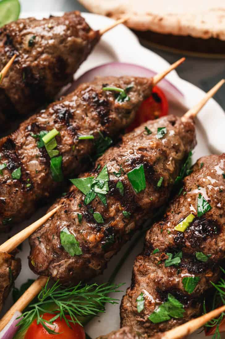 Closeup of a beef kafta recipe on wooden skewers.