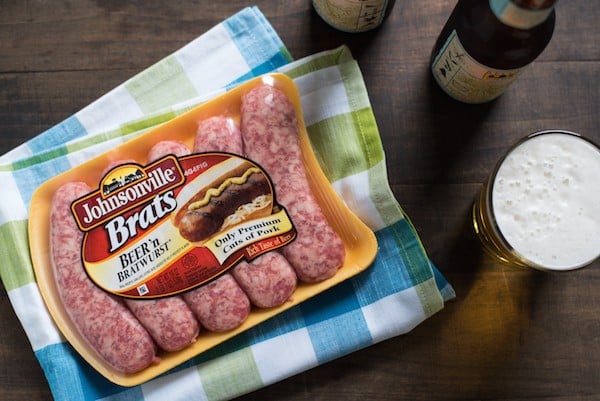 Beer Brats with Beer Queso - For the beer and grilling lovers in your life! Beer-flavored bratwurst topped with a sharp cheddar-beer queso. Serve with beer! | foxeslovelemons.com