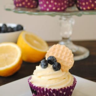 Blueberry Cupcakes with Lemon Cream Cheese Frosting - Lemon-flecked Greek yogurt blueberry cupcakes with lemon cream cheese frosting. | foxeslovelemons.com