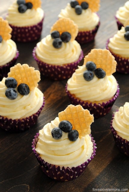 Blueberry Cupcakes with Lemon Cream Cheese Frosting - Lemon-flecked Greek yogurt blueberry cupcakes with lemon cream cheese frosting. | foxeslovelemons.com