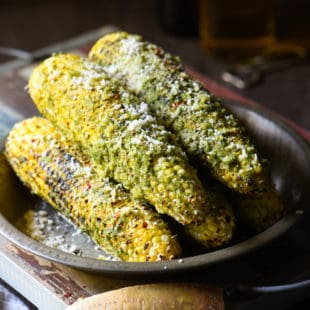 Grilled Parmesan-Pesto Sweet Corn - 4 ingredients. 8 minutes cook time. The best summer side dish ever! | foxeslovelemons.com