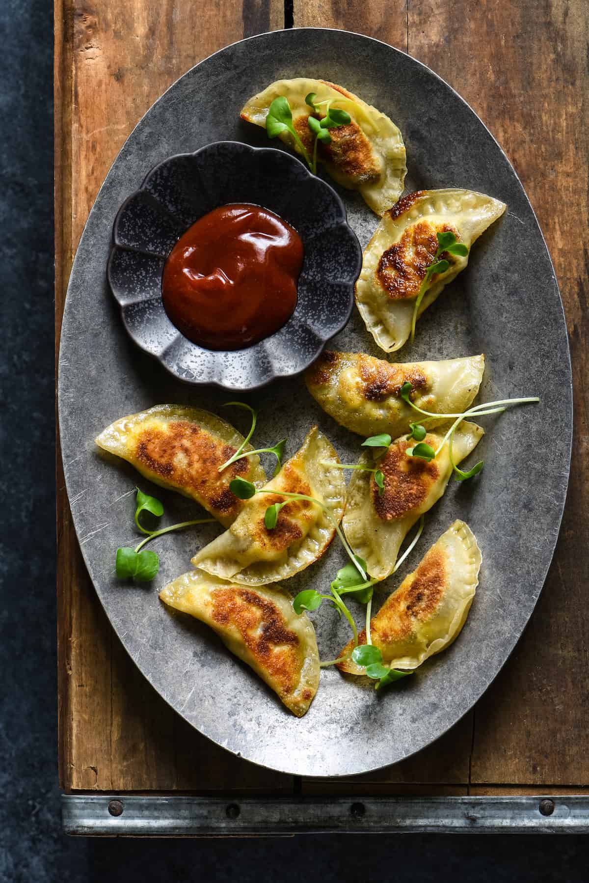 Lazy Sunday Breakfast Dumplings - Make brunch fun again with these sausage, egg and cheese wontons served with two easy dipping sauces. | foxeslovelemons.com