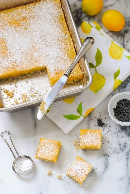 Meyer Lemon Bars with Poppyseed Crust - A flaky poppyseed crust topped with tart and sweet Meyer lemon filling. | foxeslovelemons.com