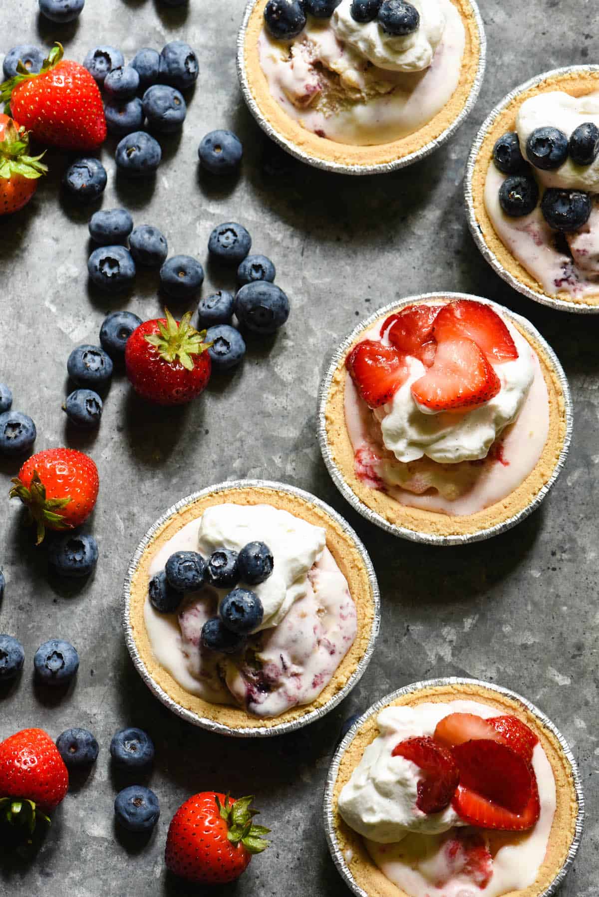 Celebrate summer's sweeter moments with Mini Ice Cream Pies. They take just minutes to put together, and there's no dishes to clean up once they're served! | foxeslovelemons.com