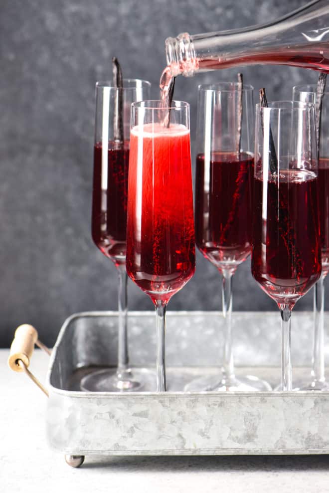 Pomegranate Vanilla Sparking Wine Cocktails - 3 ingredients + 5 minutes = this festive, fruity, bubbly cocktail. Cheers! | foxeslovelemons.com