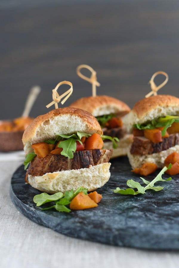 Pork Tenderloin Sliders with Spiced Apple Compote - Seared pork tenderloin topped with spiced cooked apples and peppery arugula. Serve as a party bite or a light dinner! | foxeslovelemons.com