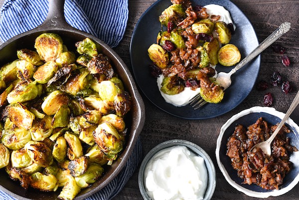 Roasted Brussels Sprouts with Greek Yogurt & Bacon Jam - A restaurant-quality side dish that you can easily serve at home. The whole family will eat their vegetables with this one! | foxeslovelemons.com