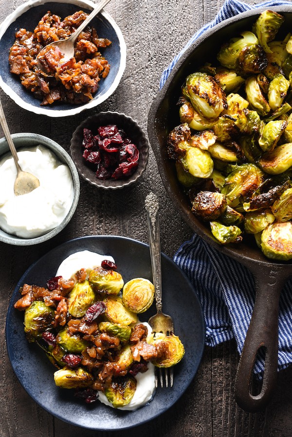 Roasted Brussels Sprouts with Greek Yogurt & Bacon Jam - A restaurant-quality side dish that you can easily serve at home. The whole family will eat their vegetables with this one! | foxeslovelemons.com