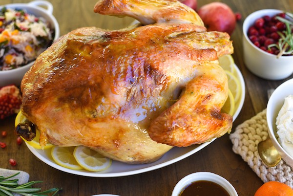 Roasted Turkey with Bourbon Apricot Glaze - Jazz up a classic roasted turkey with this simple glaze that gets brushed on when the bird comes out of the oven! | foxeslovelemons.com