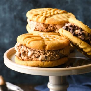 Salted Peanut Butter and Chocolate-Chocolate Chip Ice Cream Sandwiches - Make these for the chocolate and peanut butter lover in your life! Peanut butter cookies are finished with flaky sea salt and then sandwiched with triple-chocolate ice cream. | foxeslovelemons.com