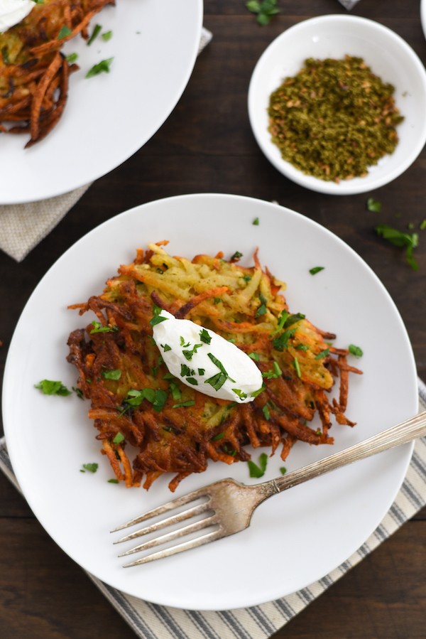 Spiced Potato & Carrot Latkes - Crispy and crunchy on the outside and light and fluffy on the inside, with tons of flavor in each bite. | foxeslovelemons.com