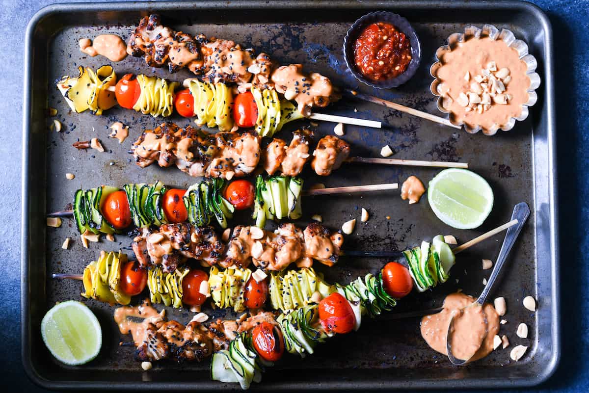 Spicy Peanut Chicken Skewers - The whole family will love this easy grilled take on peanut chicken satay. Serve with veggie skewers for a complete meal! | foxeslovelemons.com