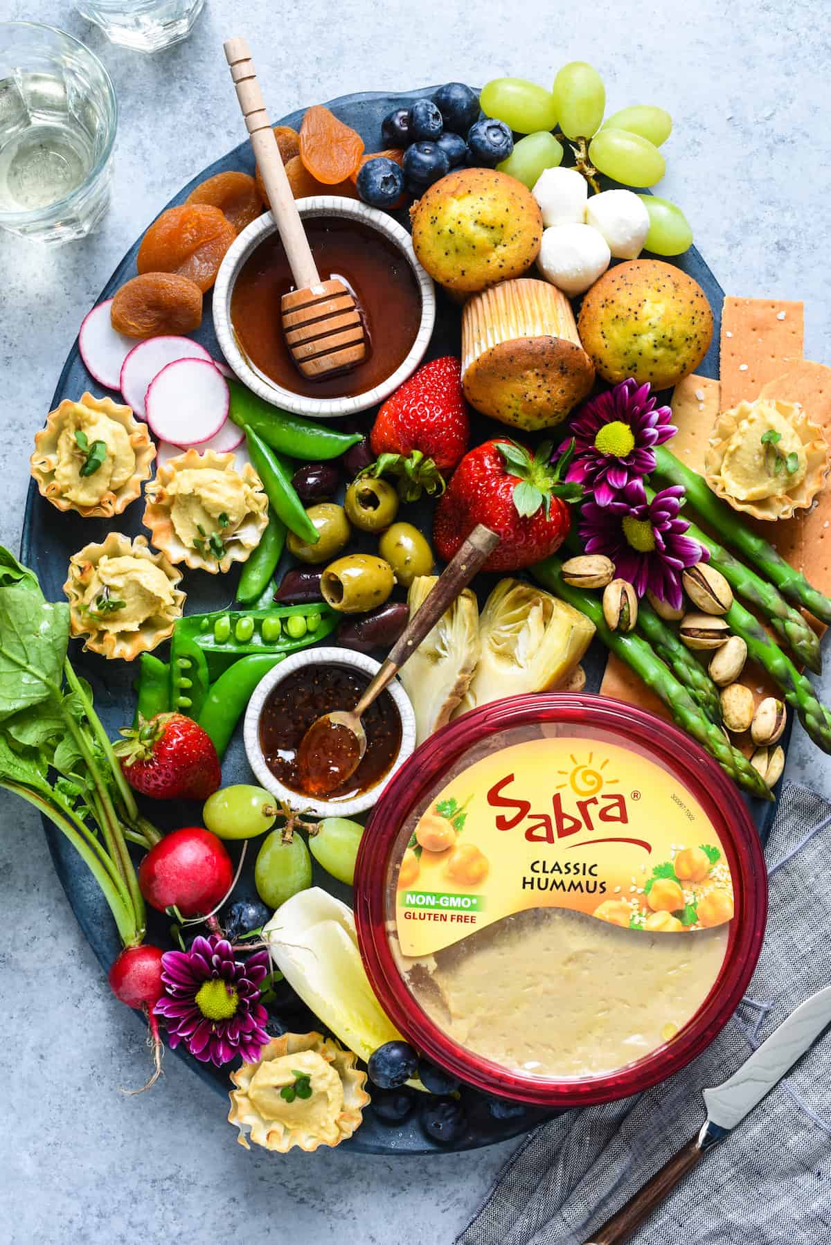 Spring Snack Platter with Hummus Phyllo Bites - A fresh, satisfying unofficial meal filled with seasonal produce and fun goodies. | foxeslovelemons.com