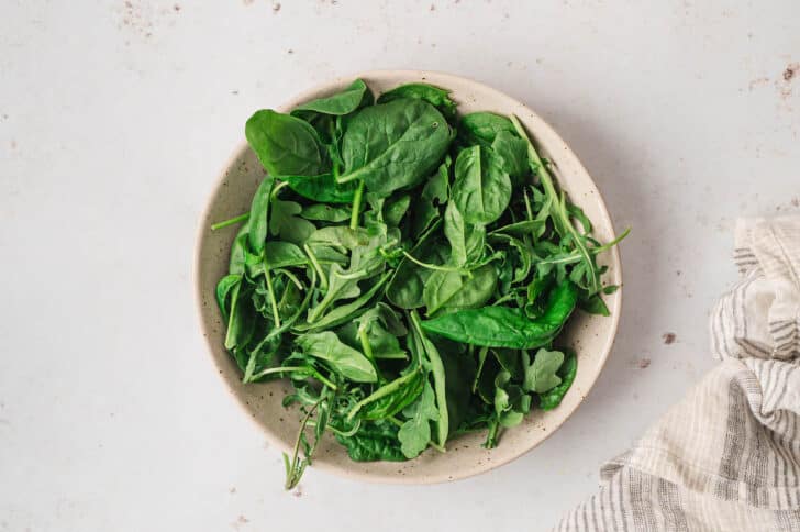 A bowl filled with greens.