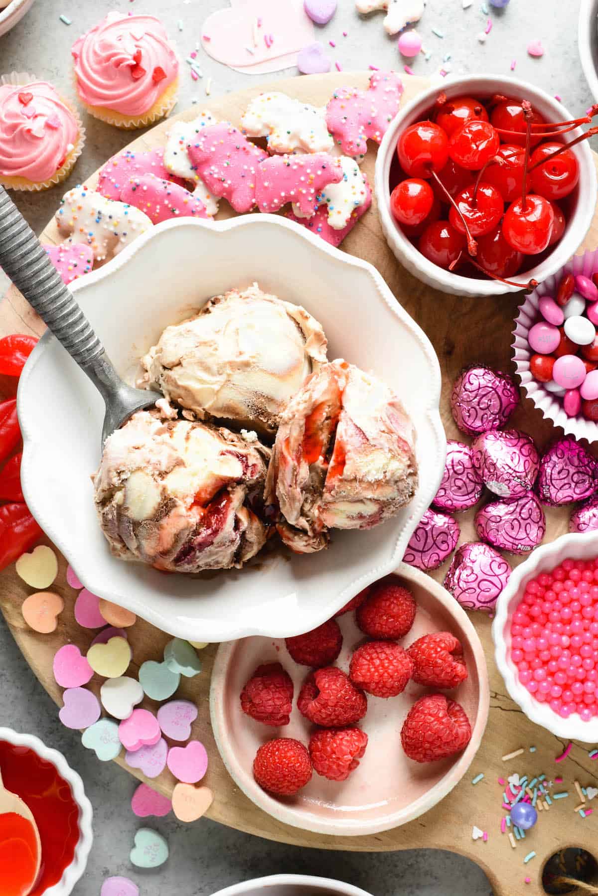 Make the holiday extra sweet with this dreamy Valentine's Day Dessert Board featuring ice cream, fruit, candies, chocolate and sprinkles! | foxeslovelemons.com